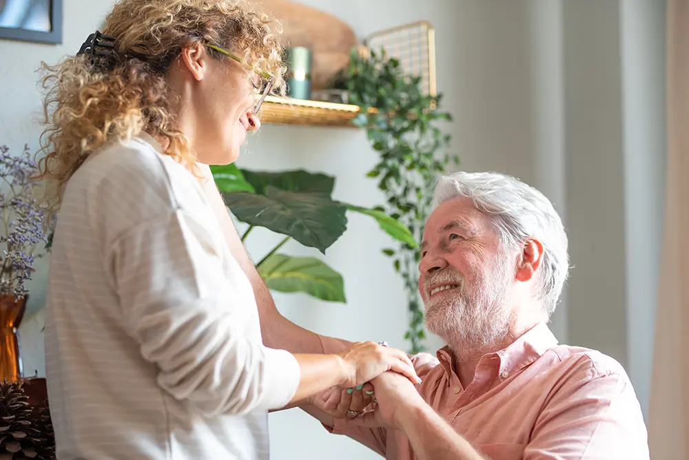 Family caregiver providing support and assistance to an older adult in southern Oklahoma